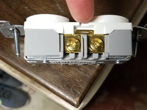 remove connecting tabs from electrical outlet